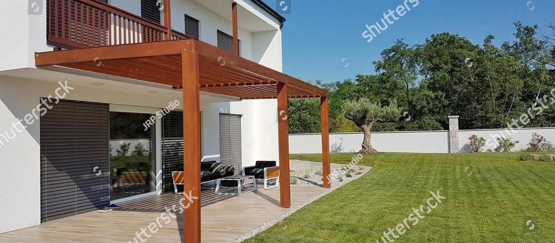 stock-photo-pergola-over-terrace-and-home-garden-679250476