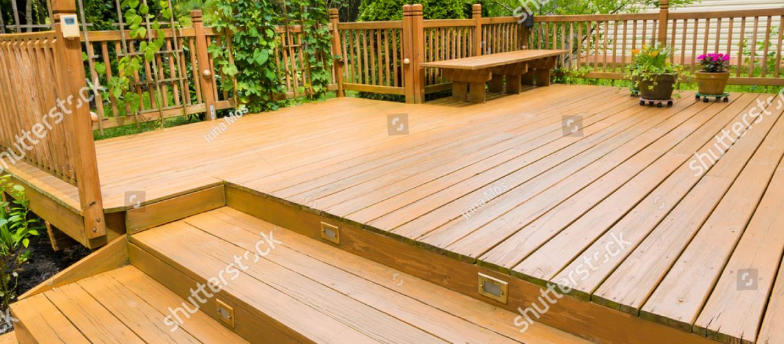 stock-photo-wooden-deck-of-family-home-672201631